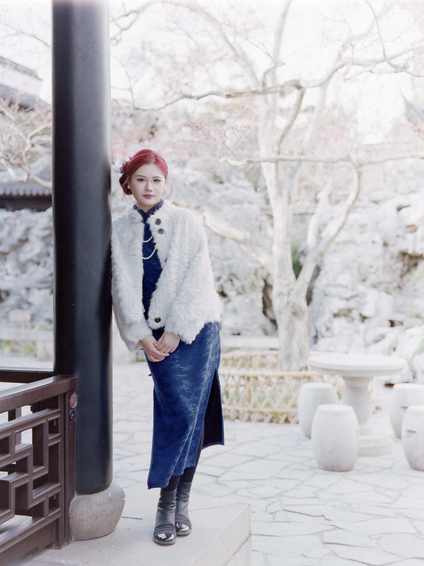 Full-length portrait among snow-covered trees
